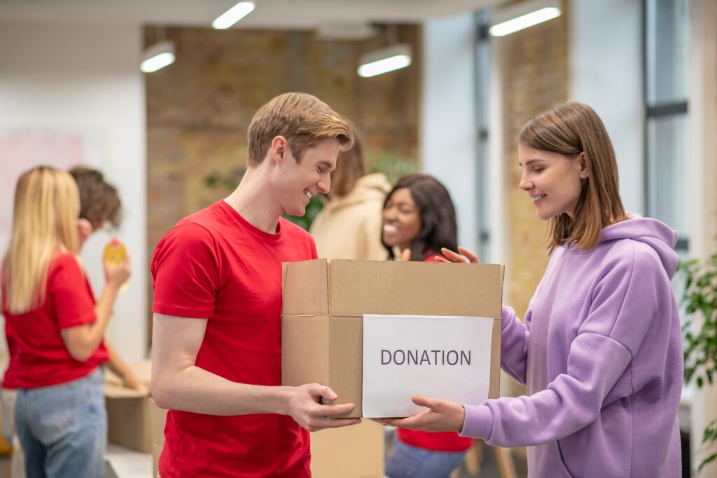 Volunteers working in a donations distribution center